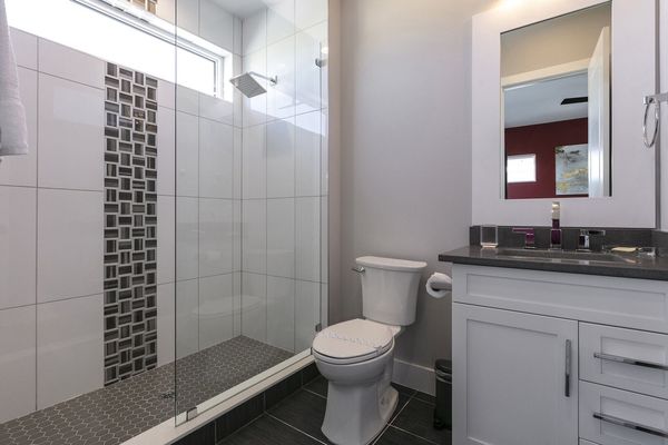 Ensuite bath with a walk-in rain water shower