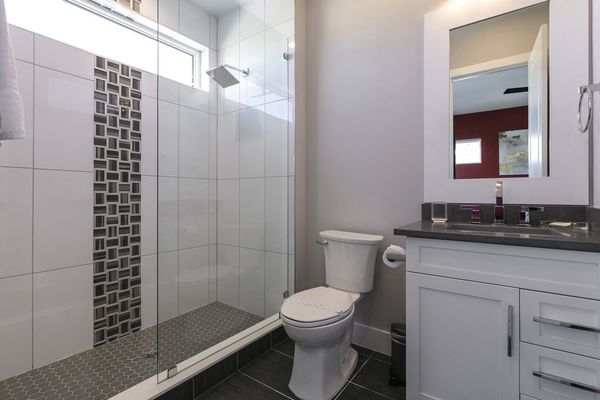 Ensuite bath with a walk-in rain water shower