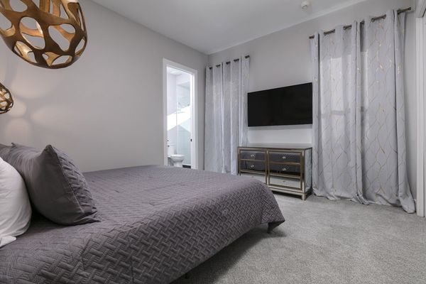 Lounge in this king-size bed and watch a movie