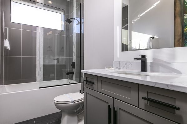 Kids can get ready in this ensuite bathroom with a shower/tub combo