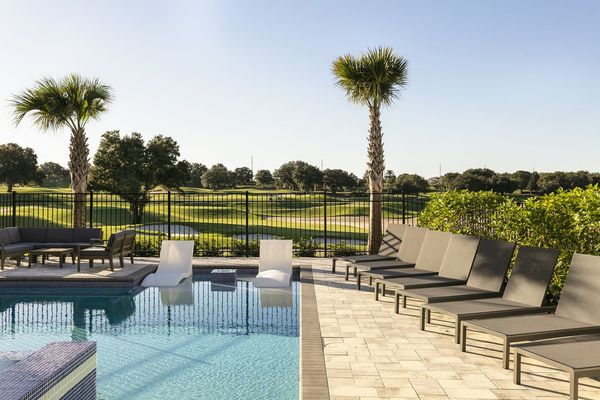 Go for a swim while the sun sets over Reunion Resort