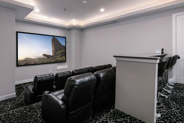 Grab some popcorn, sit back and enjoy a movie in the the home theater room