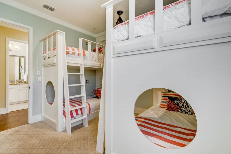 Fun kids bedroom with two sets of twin over twin bunk beds
