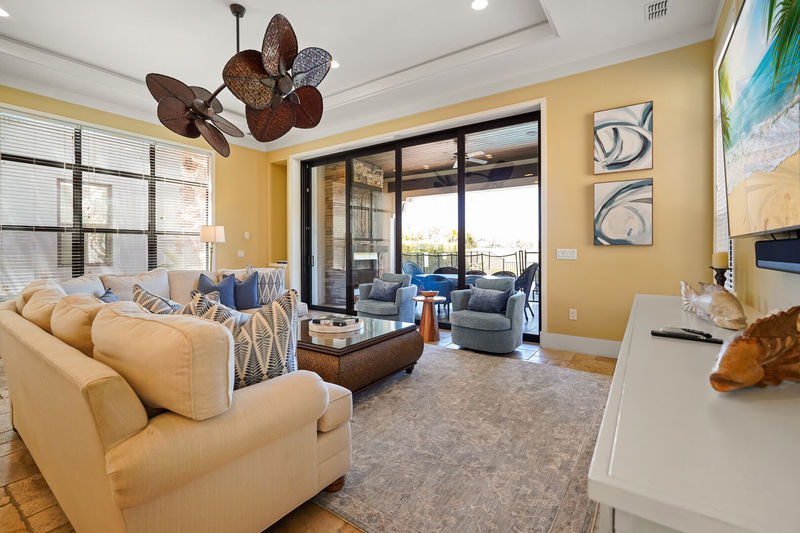 Slide open the large glass doors to access the private patio
