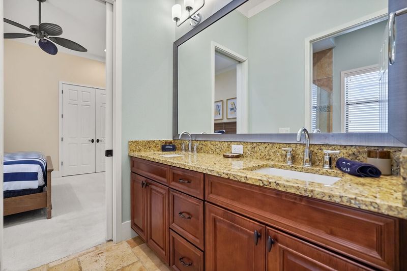 Jack and Jill bathroom has a dual vanity