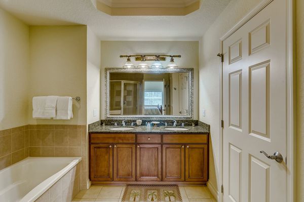Ensuite bathroom has dual vanity, garden tub and walk-in shower
