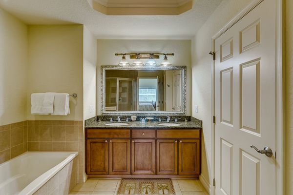 Ensuite bathroom has dual vanity, garden tub and walk-in shower