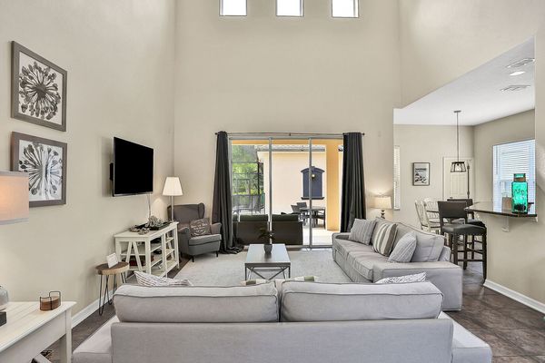 The living area leads right to the patio and has plenty of space for the whole family to gather together