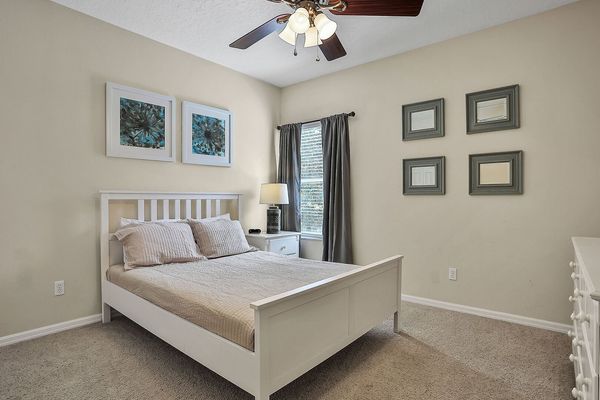 Relax in this bedroom with a queen-sized bed