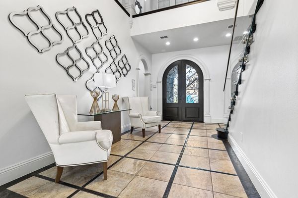 Walk through the elegant foyer to the living area