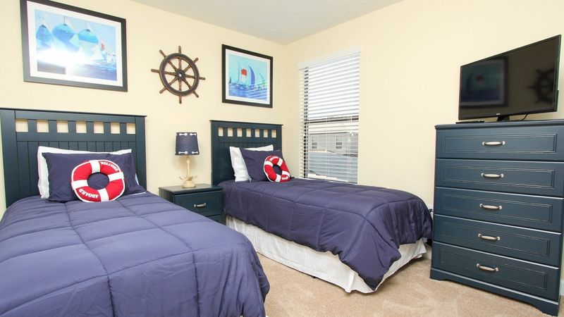 Two Twins Bedroom 6 Upstairs
Shared Bathroom-Shower
32" TV