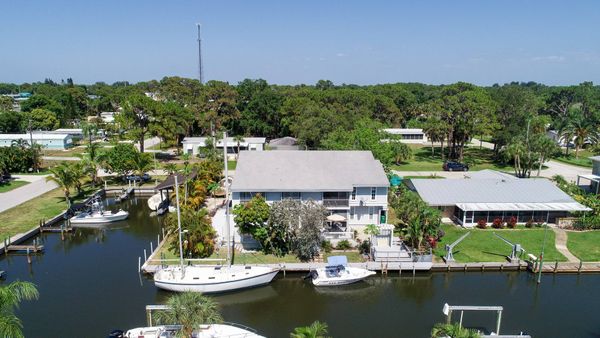 Aerial of corner canal house (Boat lift not available)