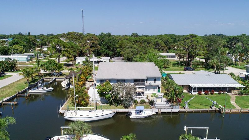 Aerial of corner canal house (Boat lift not available)