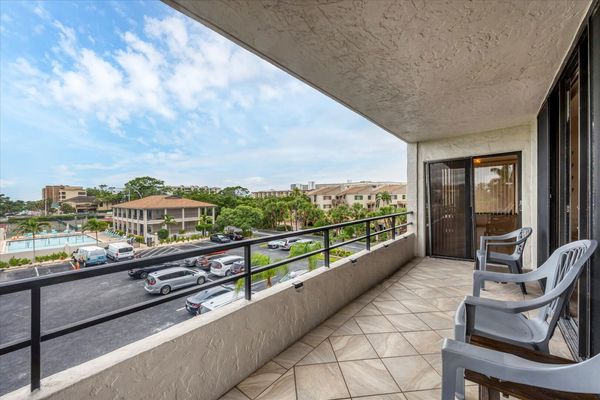 West-Facing Balcony overlooks the pool and Gulf just beyond.