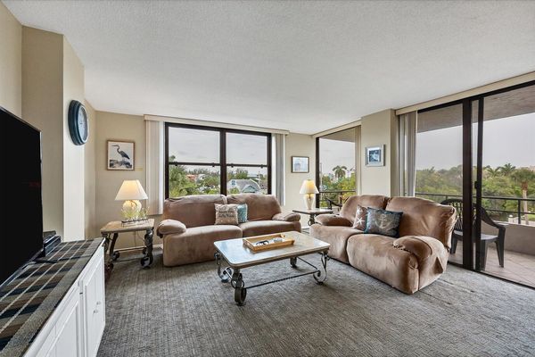 Living room features comfy sofas and 55-inch Smart TV