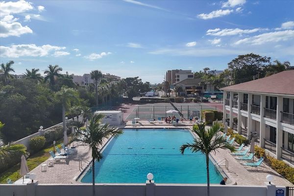 West-Facing Balcony overlooks the pool and Gulf just beyond