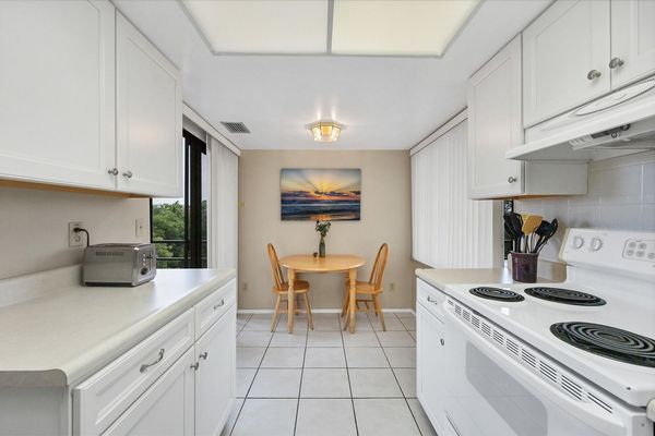 Full-equipped kitchen with breakfast nook and balcony access