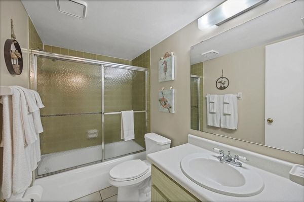Primary En Suite with Shower Tub Combo and Double Vanities