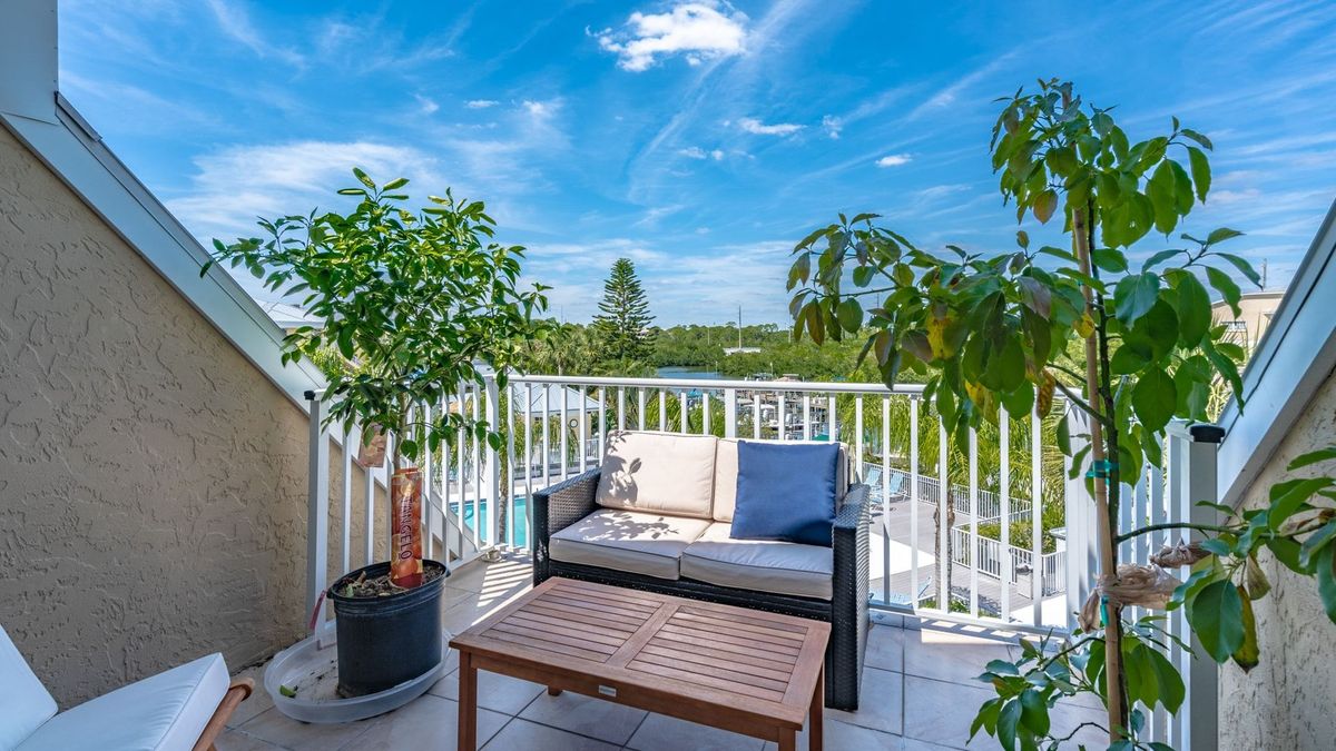 Deck Seating off the master bedroom overlooking the docks and water beyond