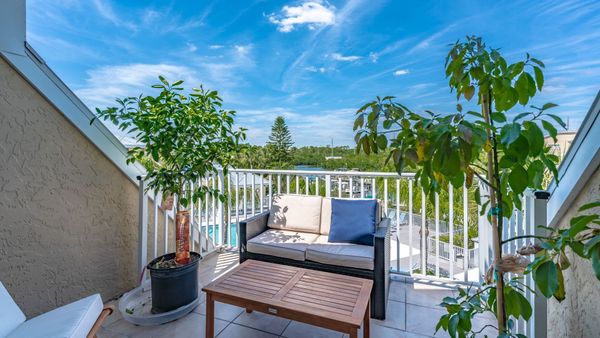 Deck Seating off the master bedroom overlooking the docks and water beyond