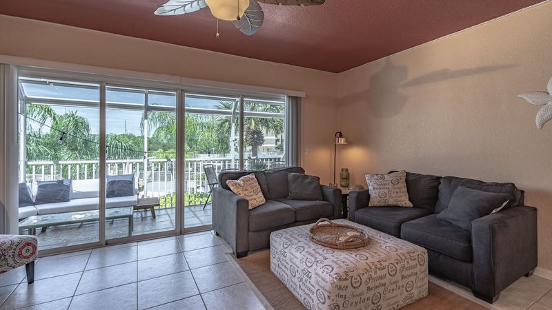 Living Room with private enclosed patio overlooking the docks