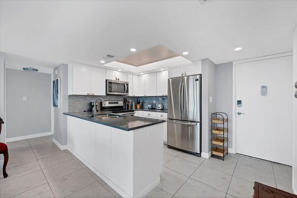 Beautifully updated, fully-equipped kitchen overlooking living room/dining room