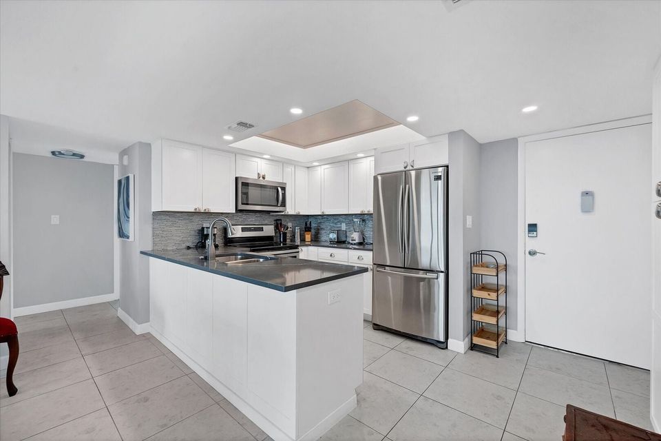 Beautifully updated, fully-equipped kitchen overlooking living room/dining room