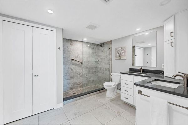 Primary en suite and large walk-shower and double vanities