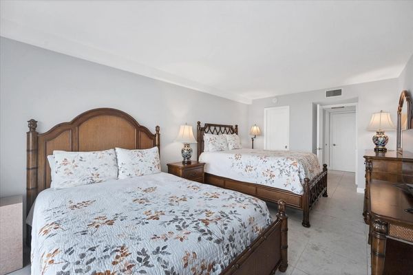 Guest bedroom with 2 queen beds and 32-inch Smart TV