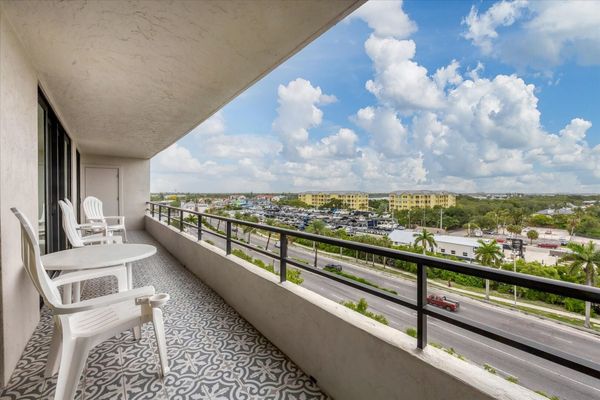 Large balcony overlooking canal with view of south Siesta Key, the Intracoastal Waterway and Gulf of Mexico