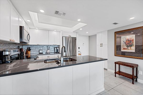 Beautifully updated, fully-equipped kitchen overlooking living room/dining room