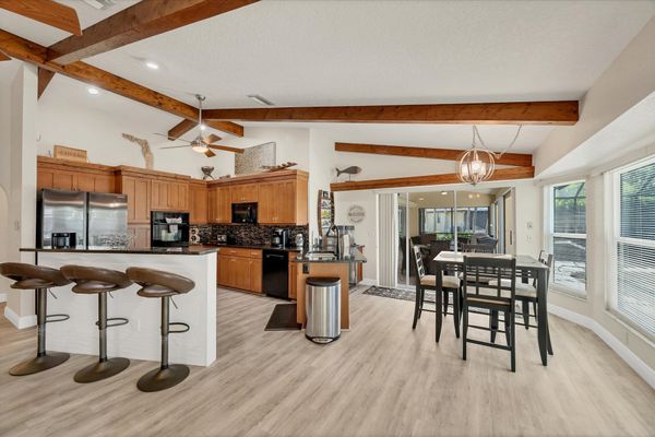 Bright, open living space overlooking the pool and canal beyond
