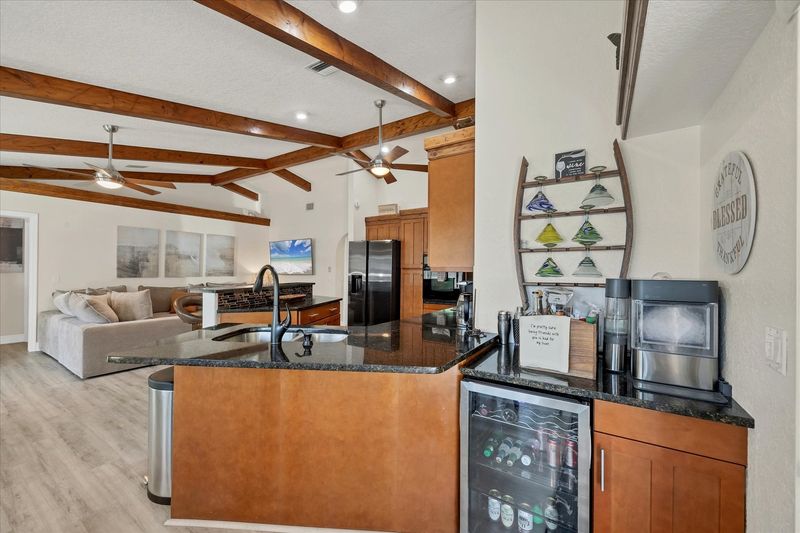 Wet bar with ice maker and beverage fridge