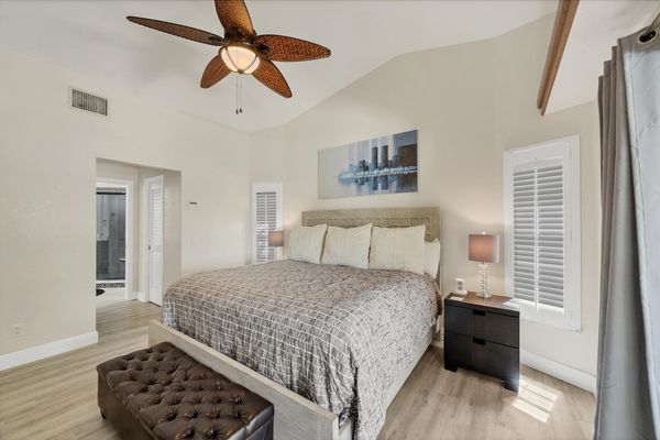 Primary bedroom with king bed, en suite, lanai access and 58" TV