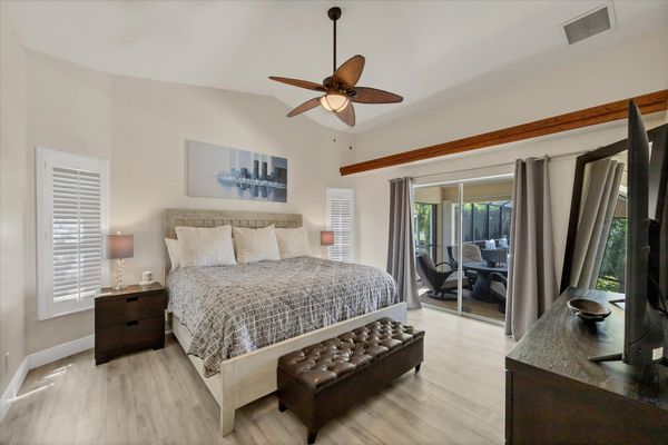 Primary bedroom with king bed, en suite, lanai access and 58" TV