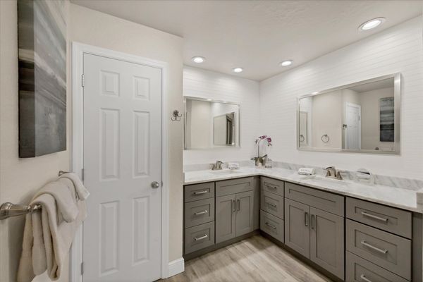 Primary en suite with with double vanities and walk-in shower