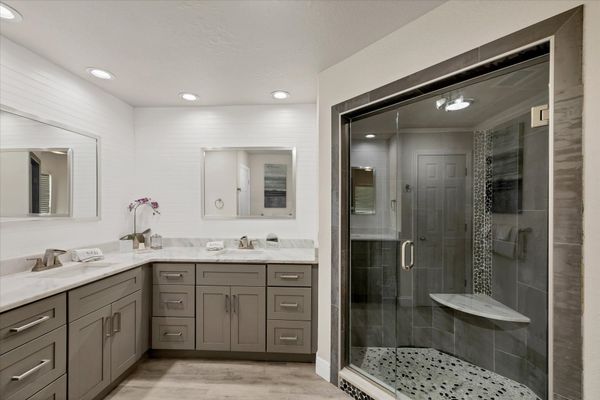 Primary en suite with with double vanities and walk-in shower