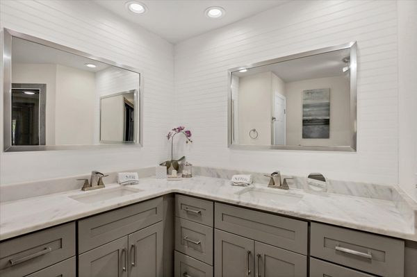 Primary en suite with with double vanities and walk-in shower