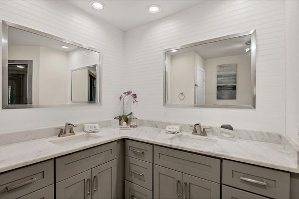 Primary en suite with with double vanities and walk-in shower