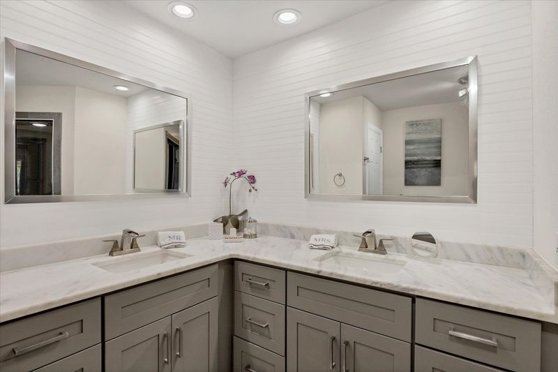 Primary en suite with with double vanities and walk-in shower