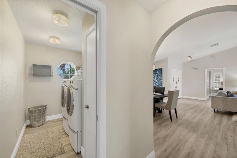 Laundry room with full-size washer and dryer