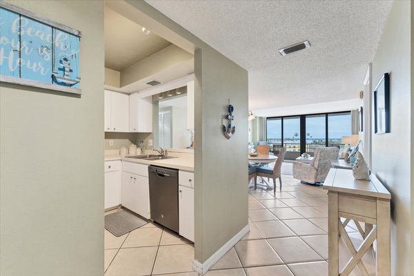 Bright, open living area with balcony access and water view