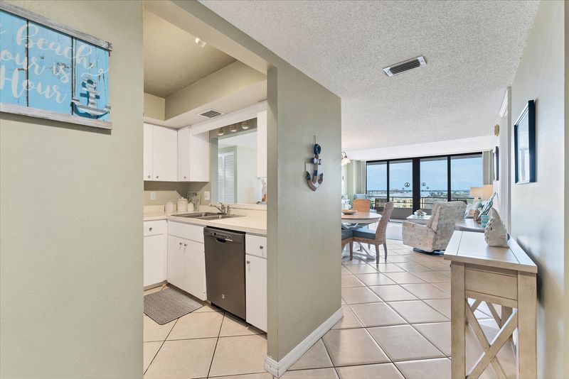 Bright, open living area with balcony access and water view