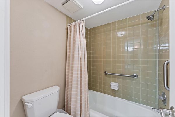 Primary attached bathroom with shower/tub combo