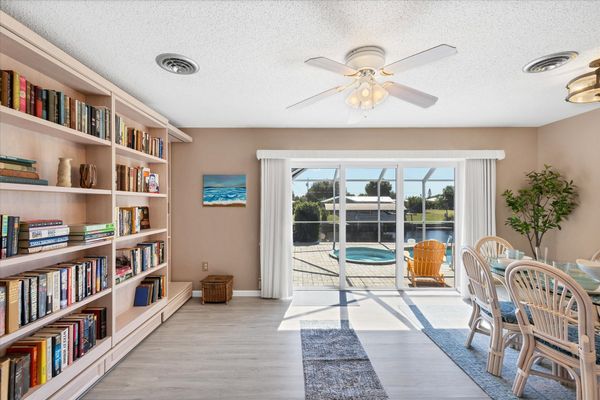 Dining room with queen Murphy bed and lanai access