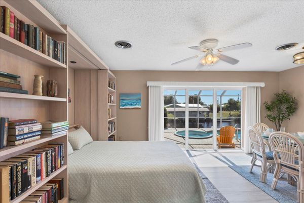 Dining room with queen Murphy bed and lanai access