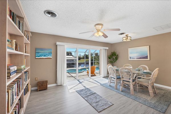 Dining room with queen Murphy bed and lanai access