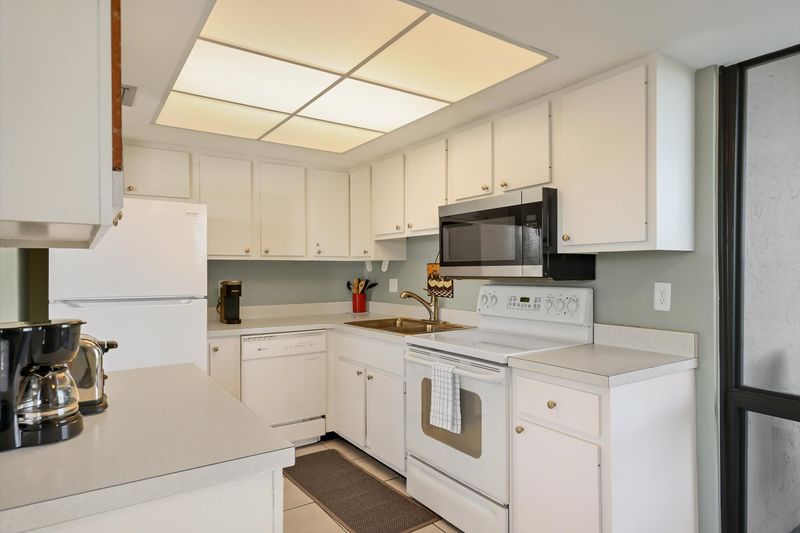 Fully-equipped kitchen with balcony access