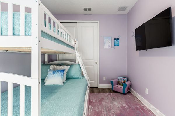 Featuring a twin over full bunkbed with a roll out trundle bed