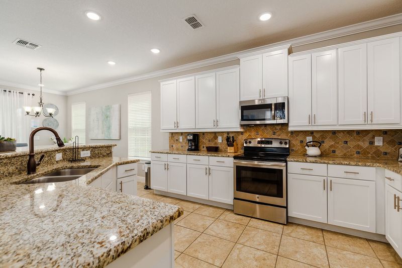 The kitchen features stainless steel appliances.